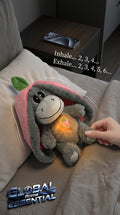 Global Prime Essential Strawberry Donkey Breathing Plush Doll lying peacefully in a cozy sleep sanctuary setting.